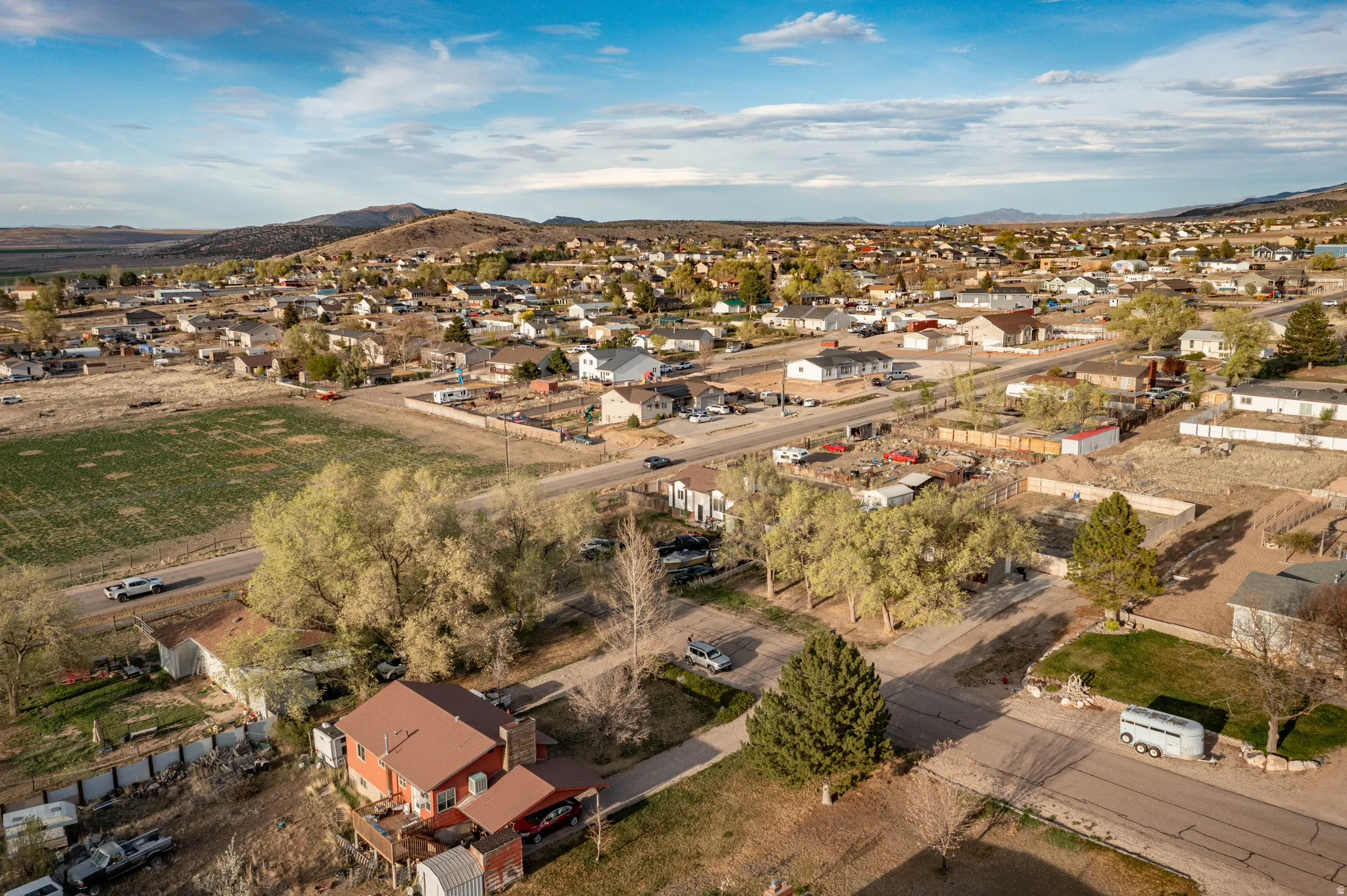 Aerial view of residential area featuring a mountainous background