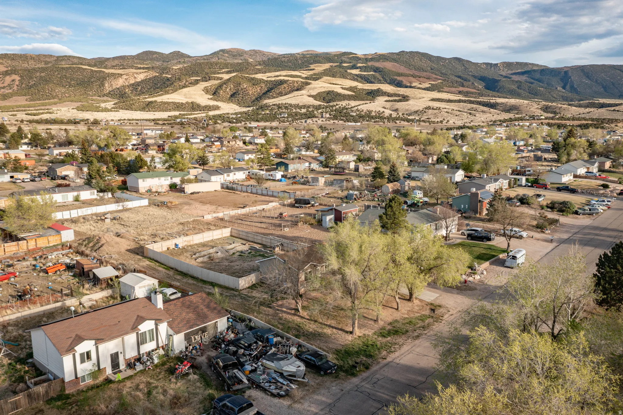 View of property location with mountains and nearby suburban area