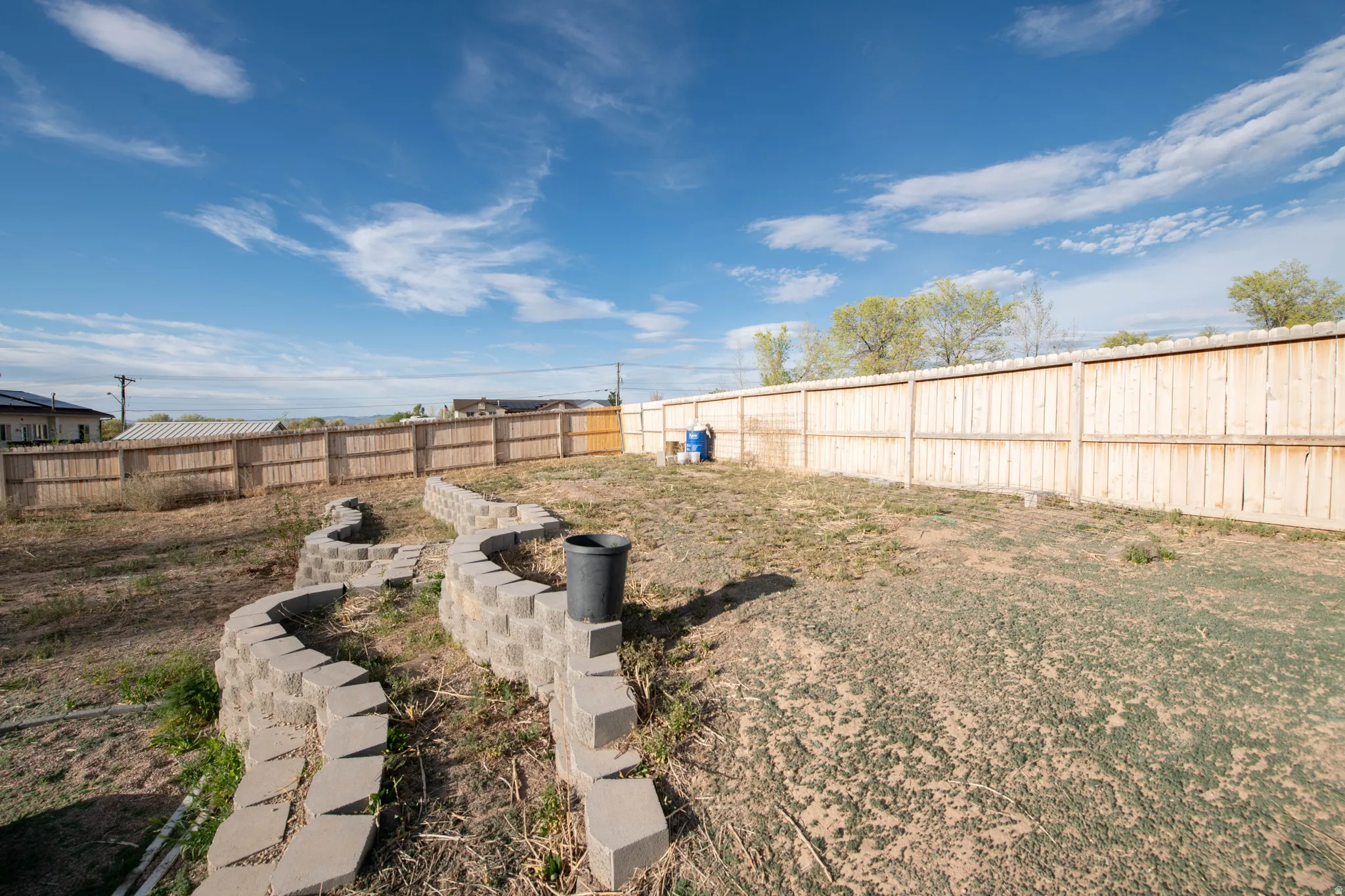 View of fenced backyard