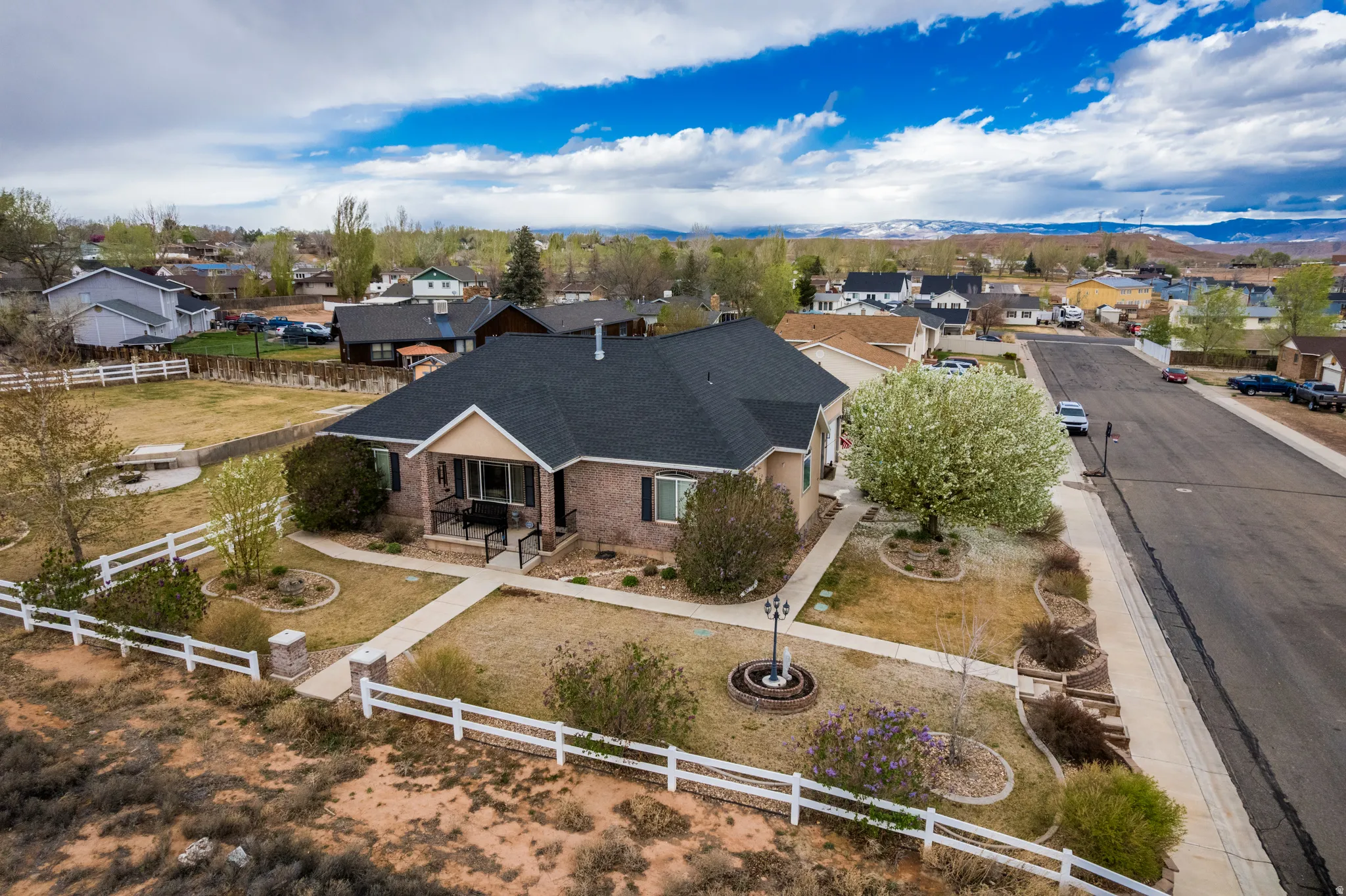 Aerial view of residential area featuring mountains