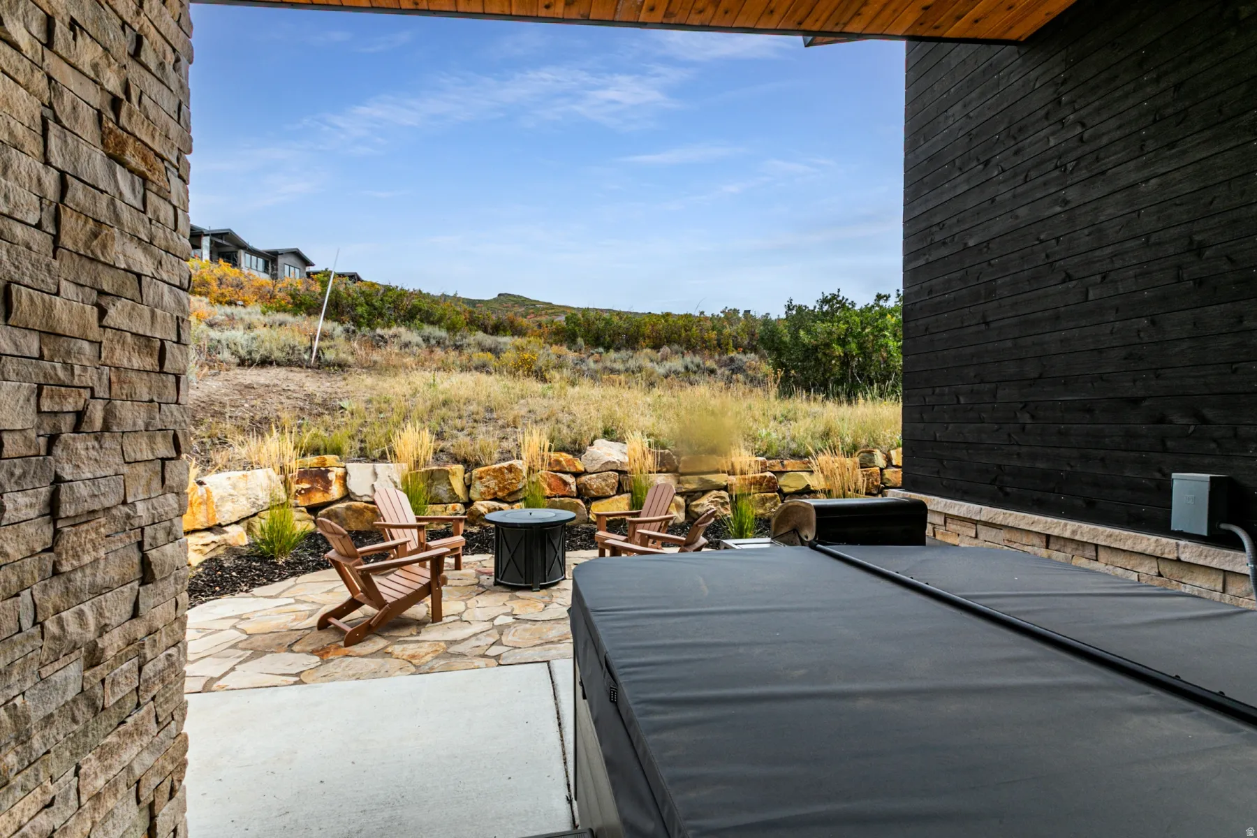View of patio / terrace with an outdoor fire pit
