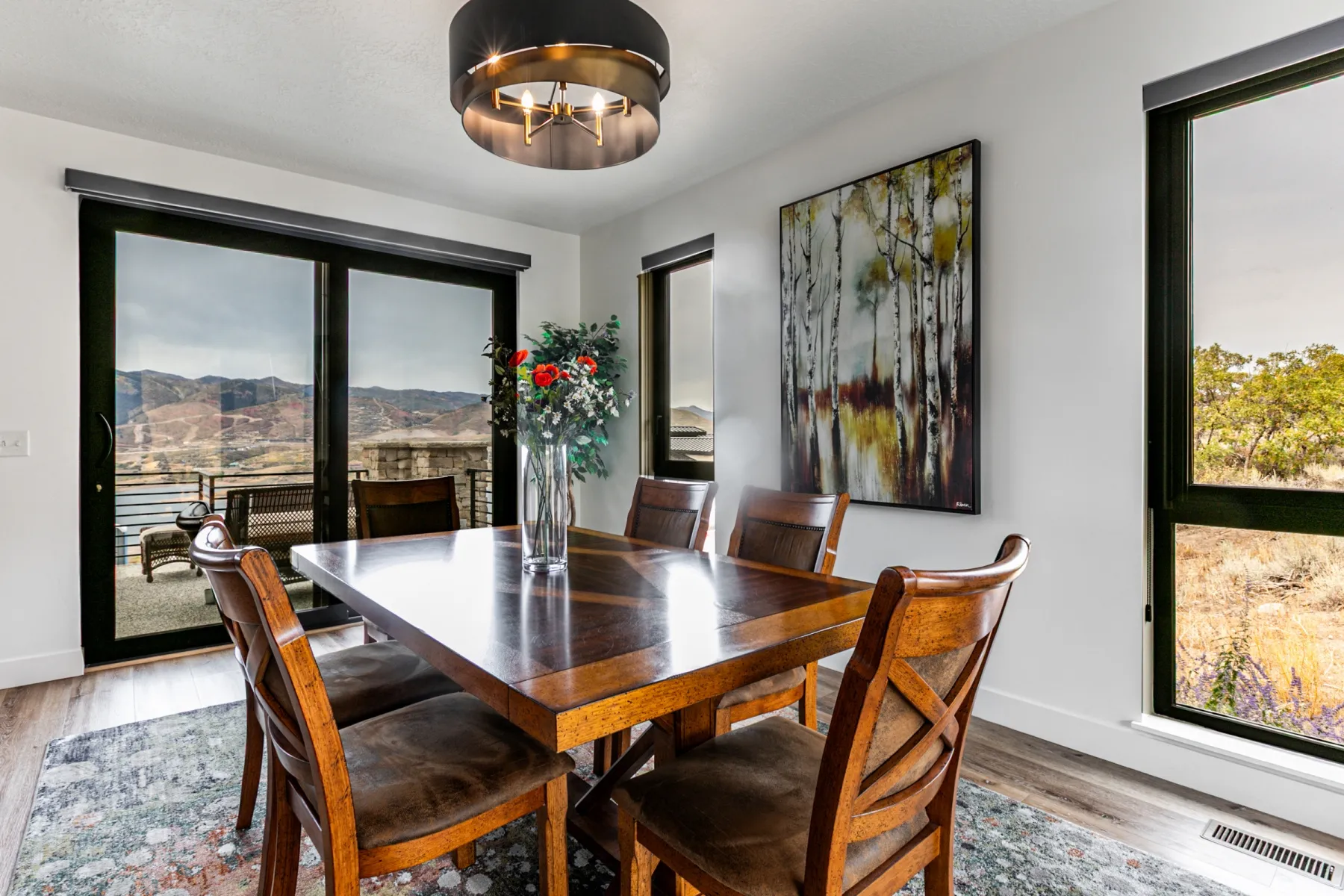 Dining area featuring light wood finished floors and a mountain view