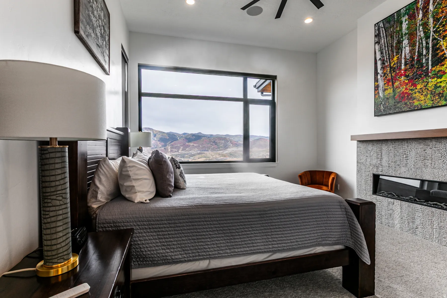 Bedroom featuring carpet, recessed lighting, a ceiling fan, and a glass covered fireplace