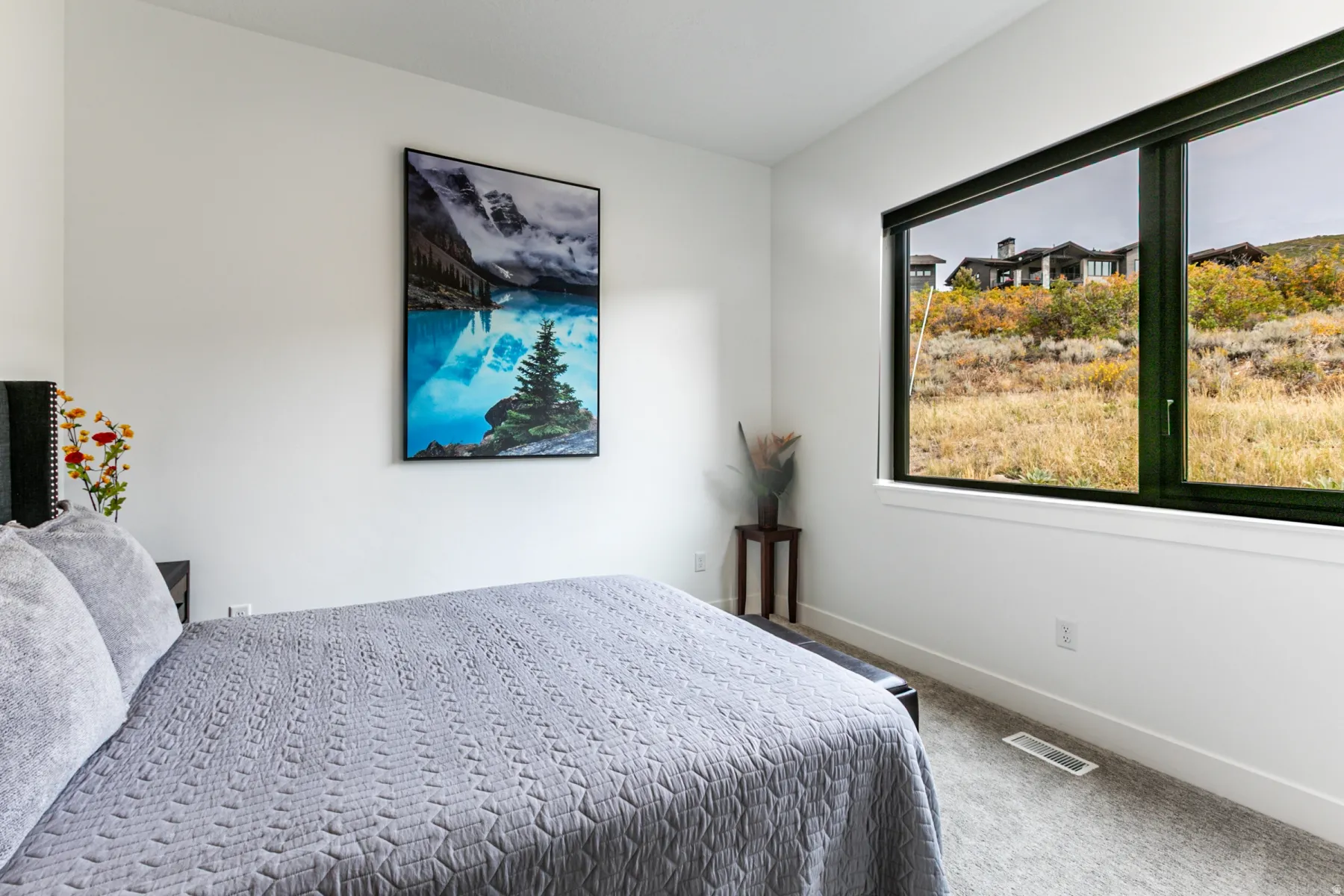 Carpeted bedroom featuring baseboards