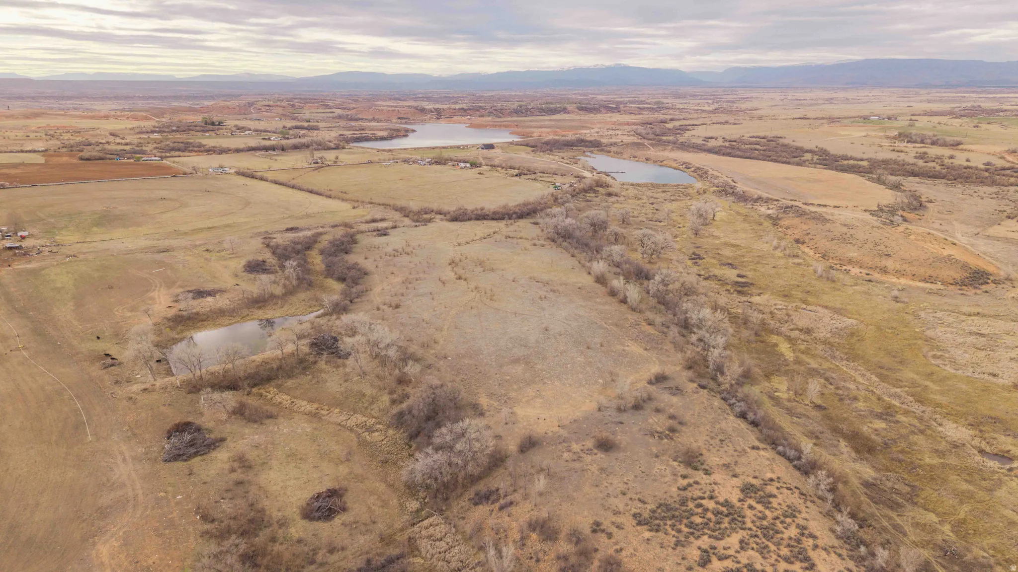 Overview of rural landscape featuring 2 lakes and a mountain view. Southeast portion of property looking N N/W.
