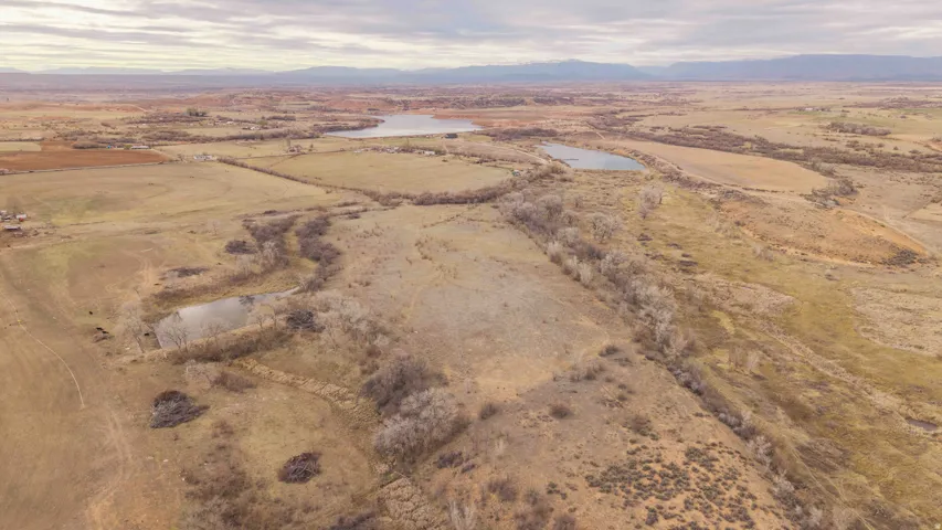 Overview of rural landscape featuring 2 lakes and a mountain view. Southeast portion of property looking N N/W.