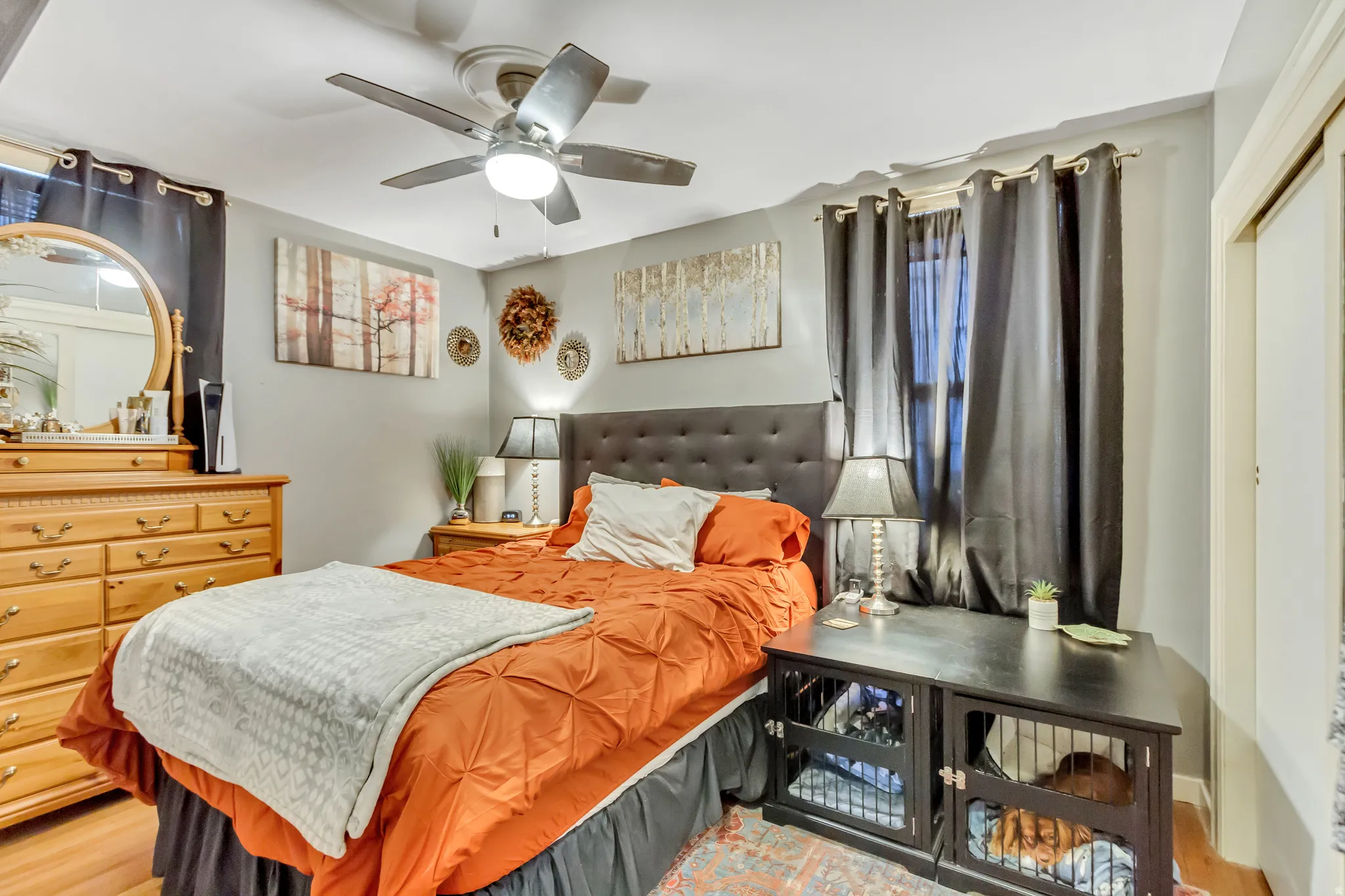 Bedroom with wood finished floors and ceiling fan