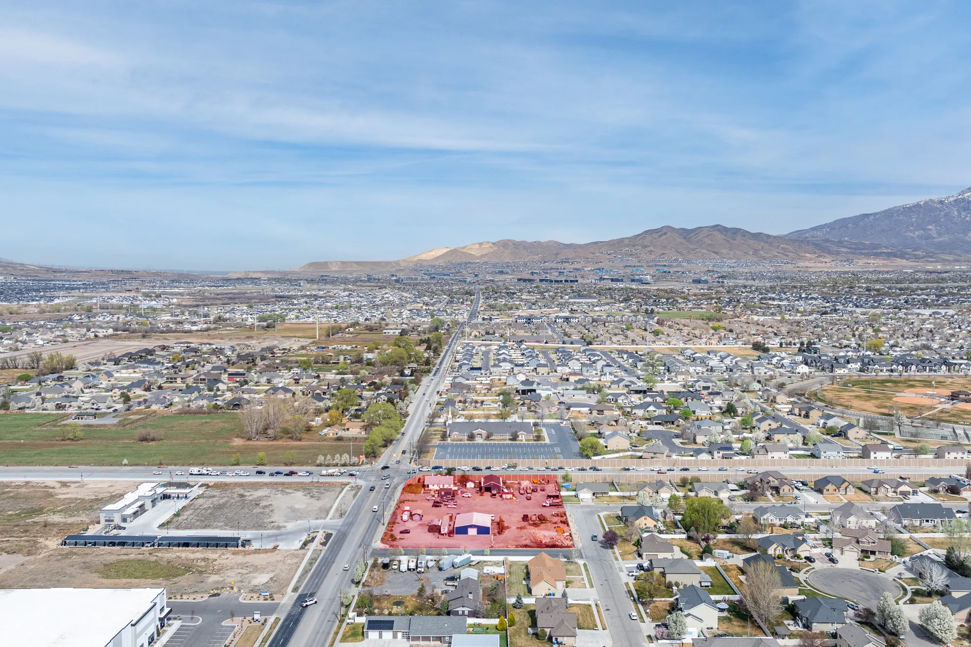 Aerial view of residential area featuring mountains