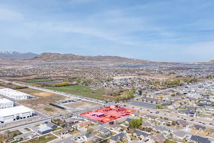Aerial view of residential area featuring mountains