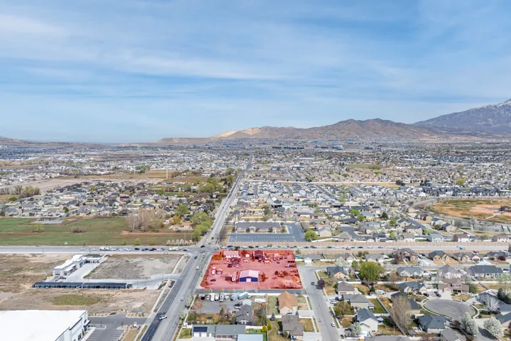 Aerial view of residential area featuring mountains