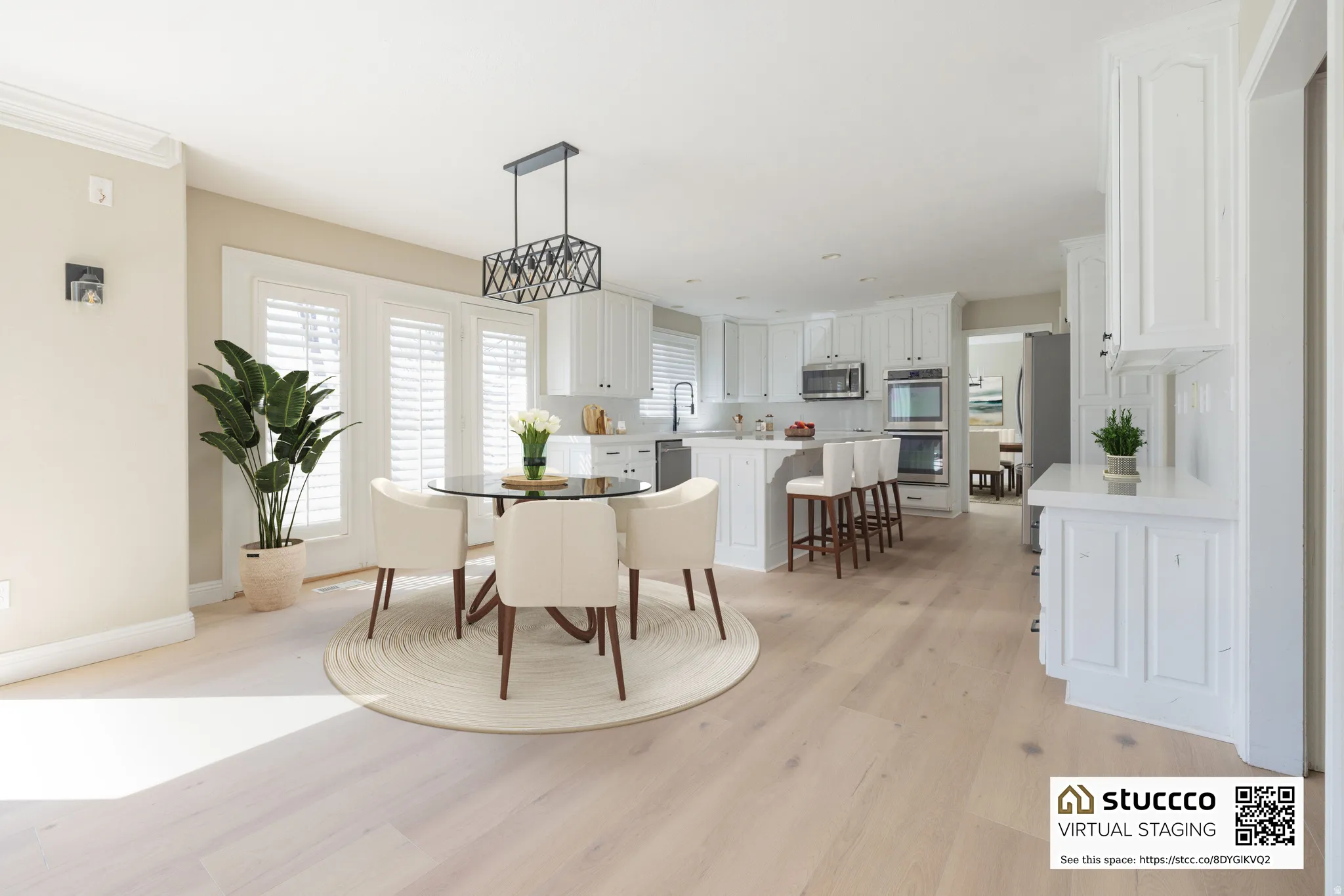 Dining space with light wood finished floors, plenty of natural light, and suspended lighting