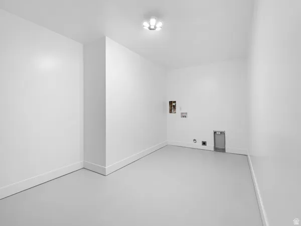 Laundry area with concrete flooring, hookup for a washing machine, and gas dryer hookup