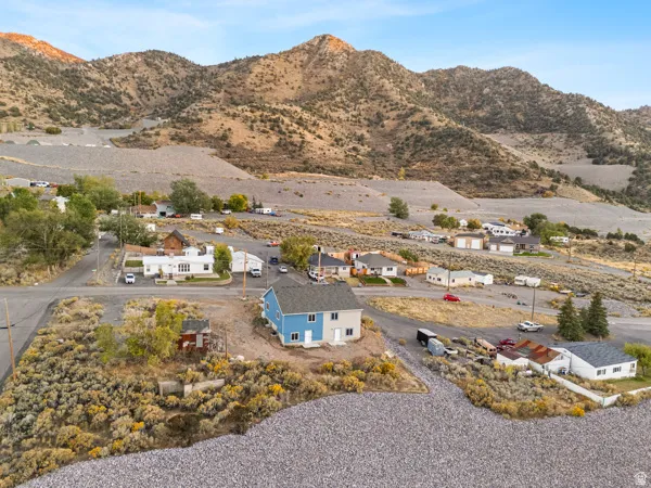 Aerial view of residential area featuring a mountainous background