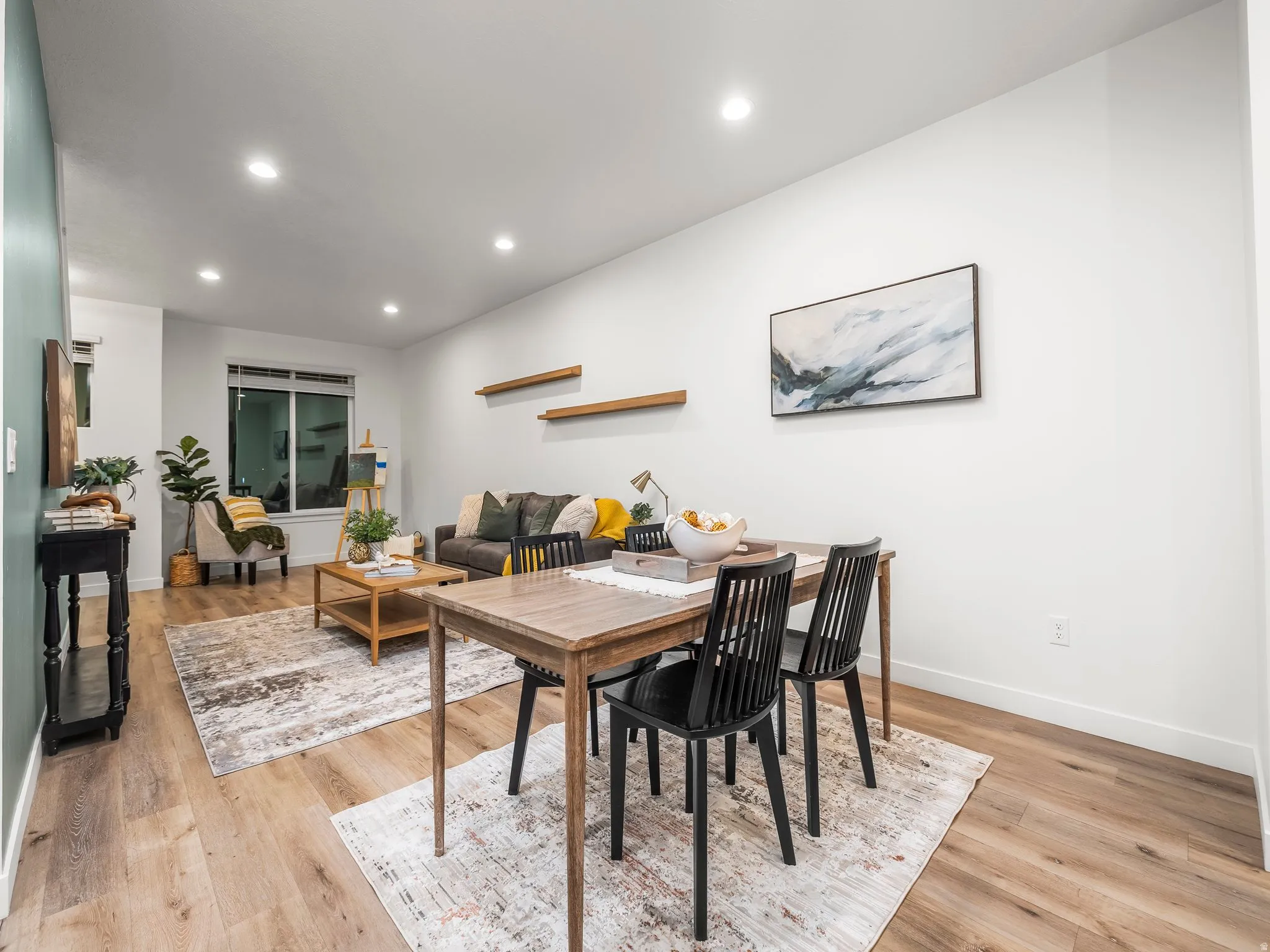 Dining space featuring recessed lighting and light wood-style flooring