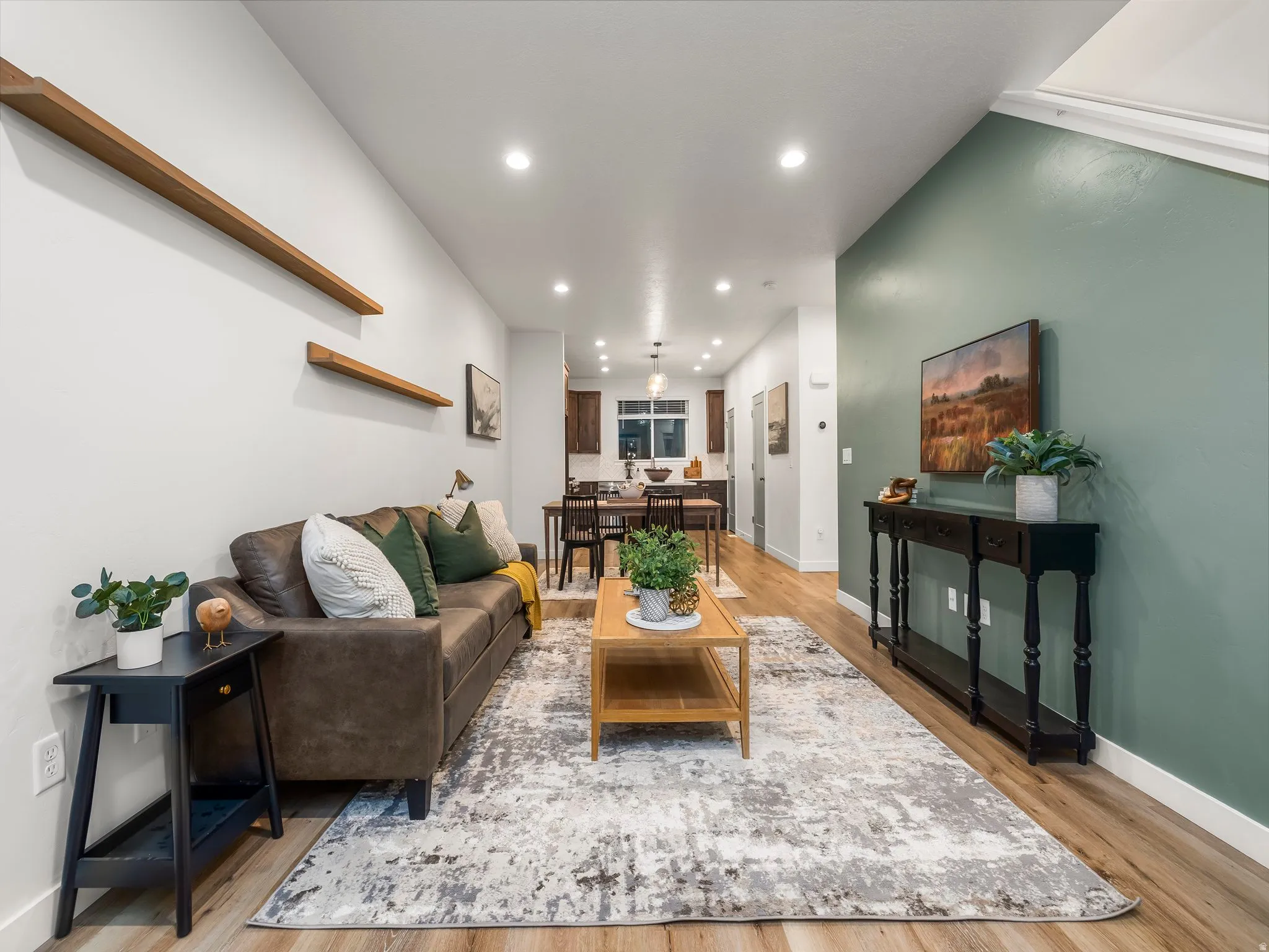 Living area with recessed lighting and light wood-style floors