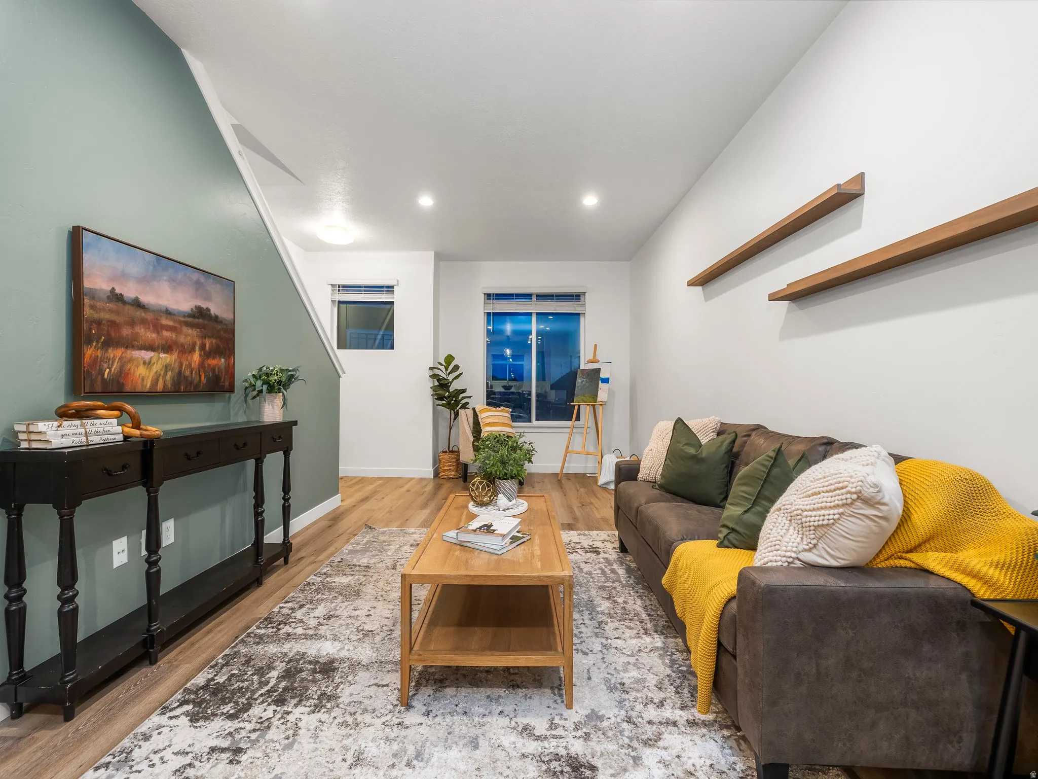 Living area featuring wood finished floors and recessed lighting