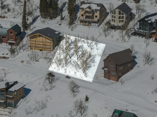 Snowy aerial view featuring a residential view