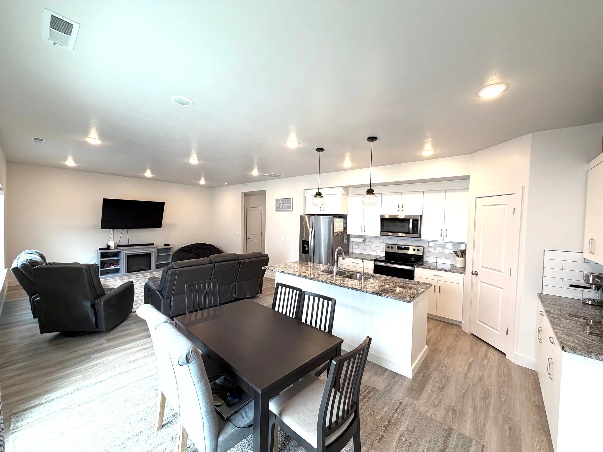 Dining space featuring light wood-style flooring and recessed lighting