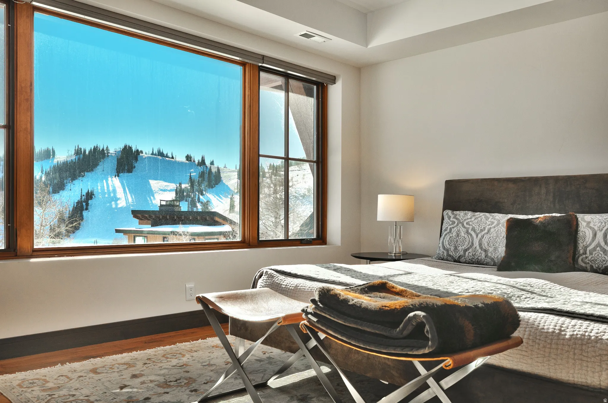 Bedroom featuring baseboards and wood finished floors