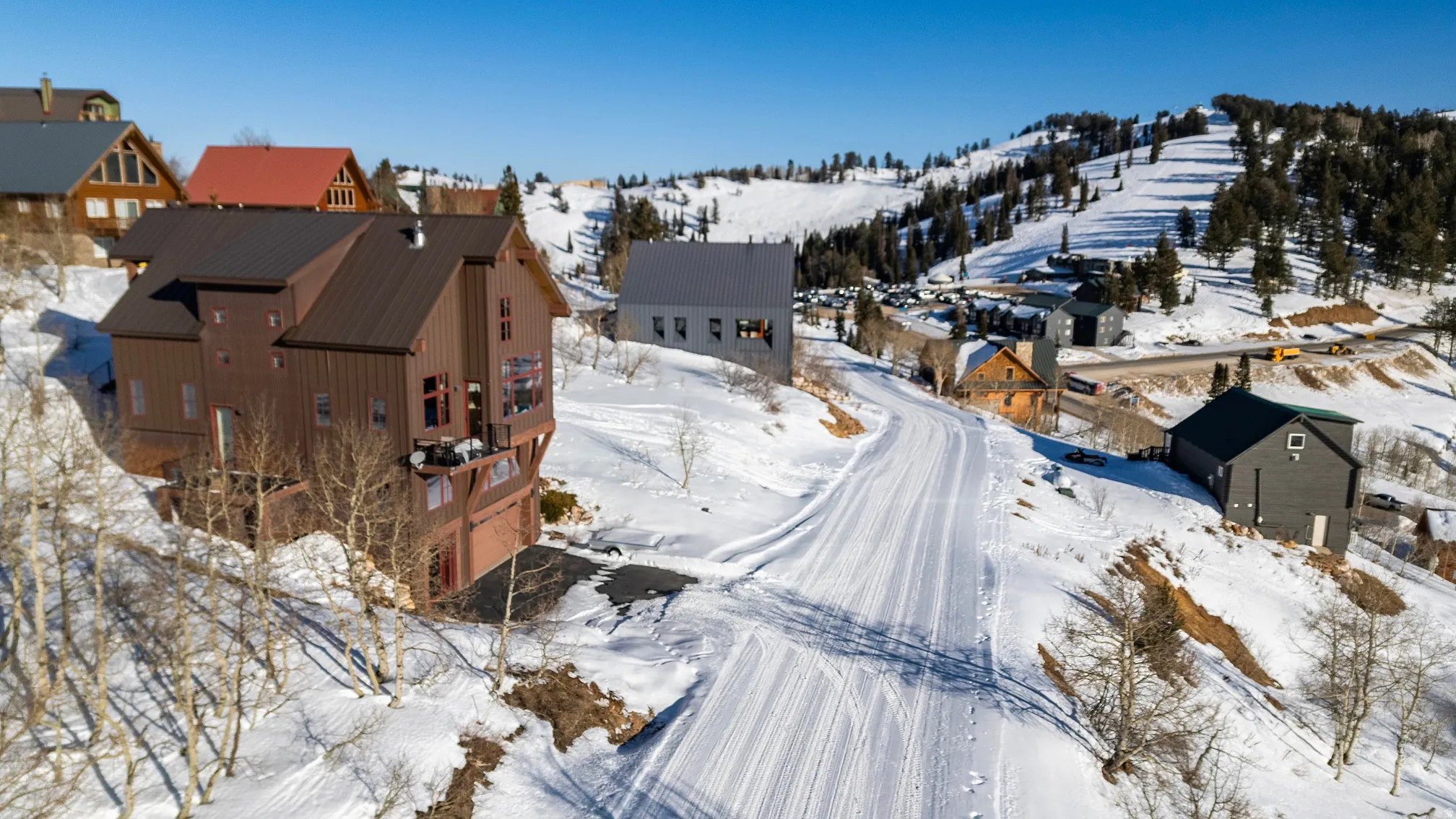 Snowy aerial view featuring a residential view