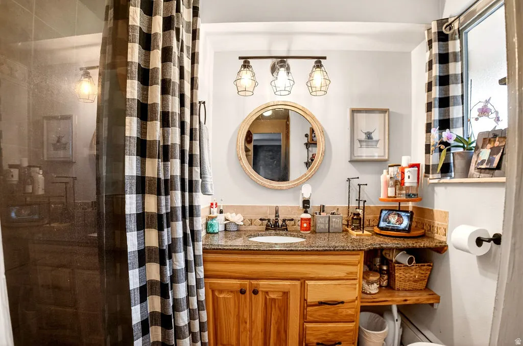 Bathroom with vanity and a shower stall