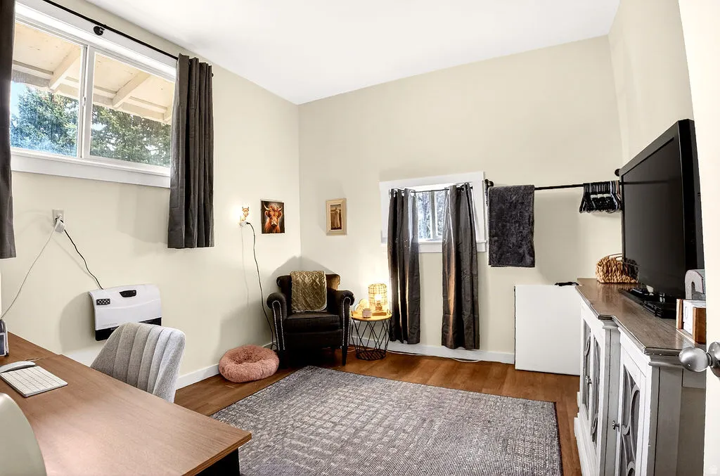 Office space with wood finished floors and baseboards