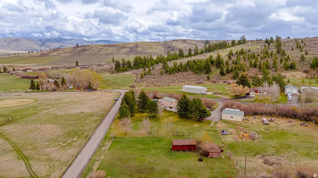 Overview of rural landscape featuring a mountainous background