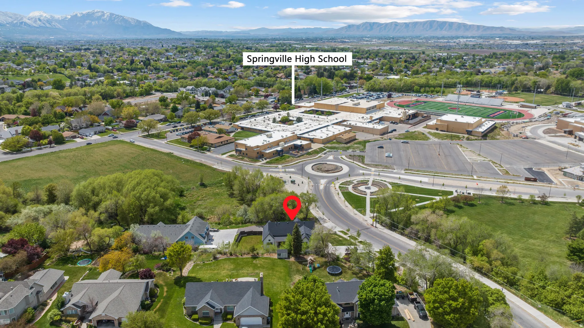 View of property location featuring a mountainous background and nearby suburban area