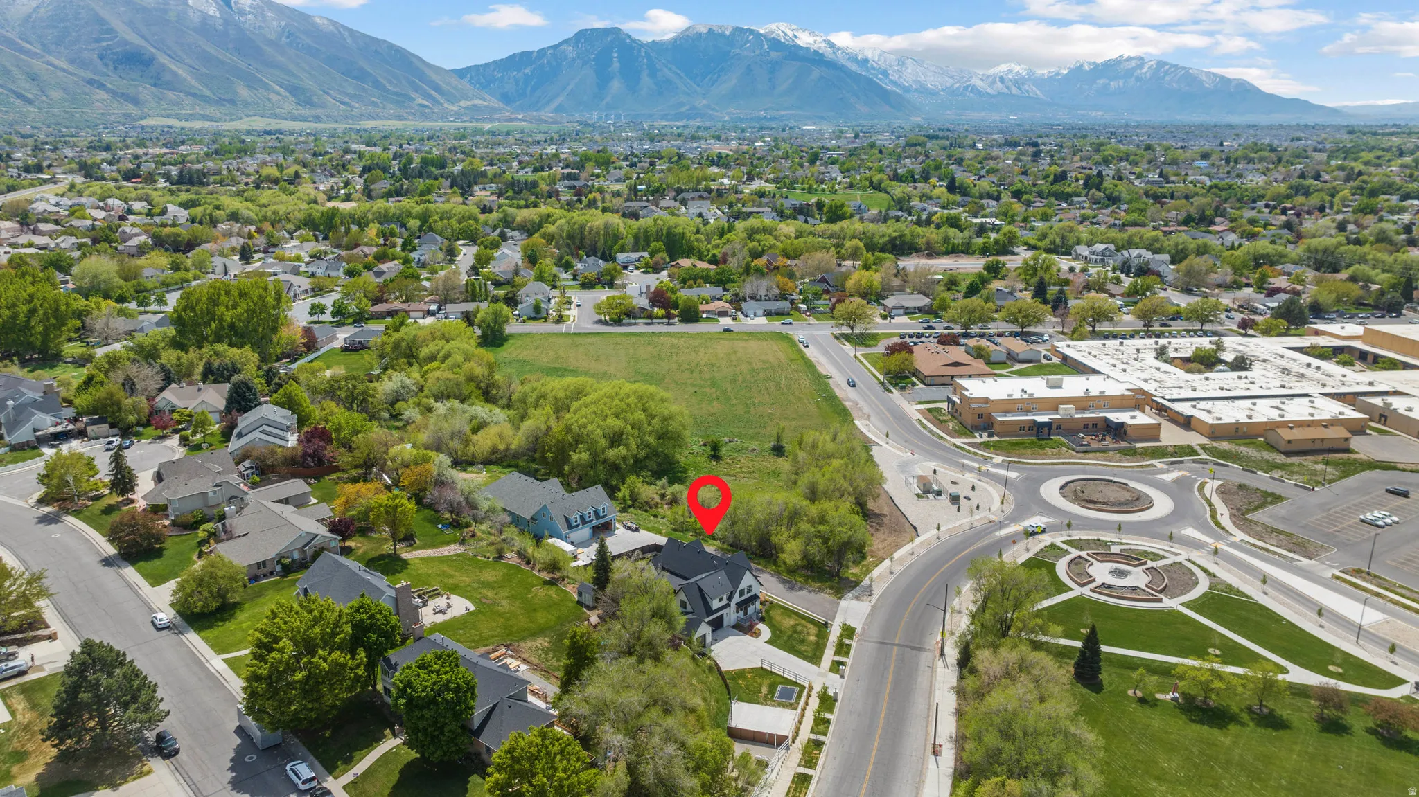 Aerial view of residential area with a mountainous background