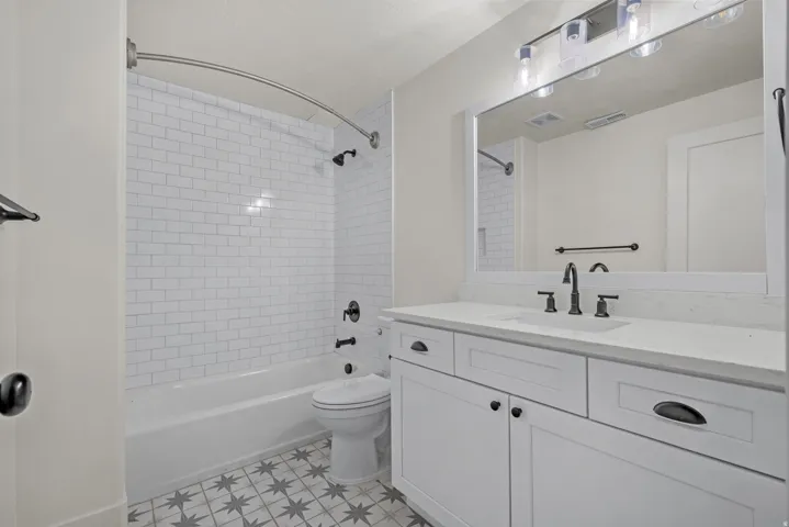 Full bath with vanity and bathtub / shower combination