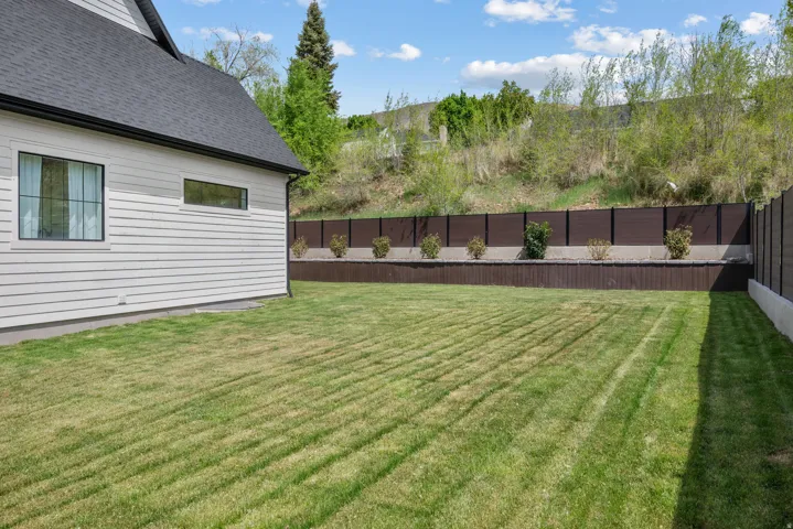 View of fenced backyard