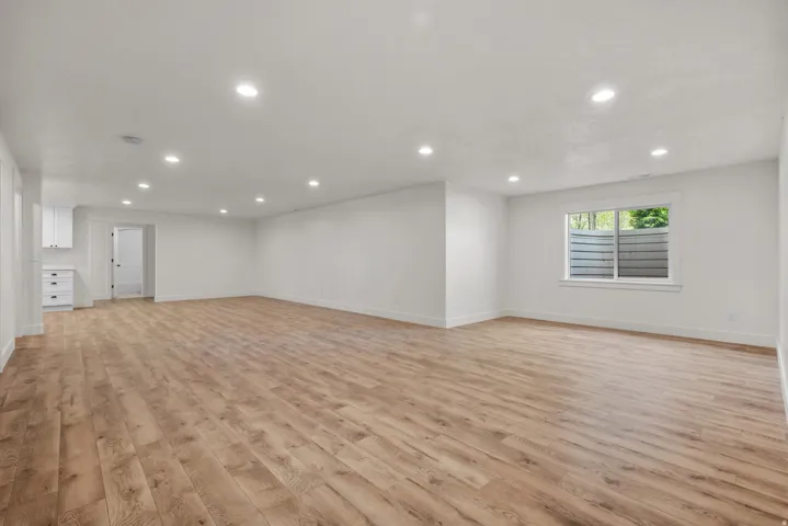 Unfurnished living room featuring light wood-style floors and recessed lighting