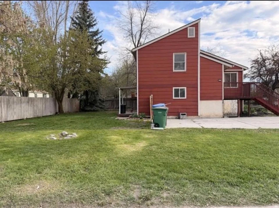 View of home's exterior with a patio area and stairs