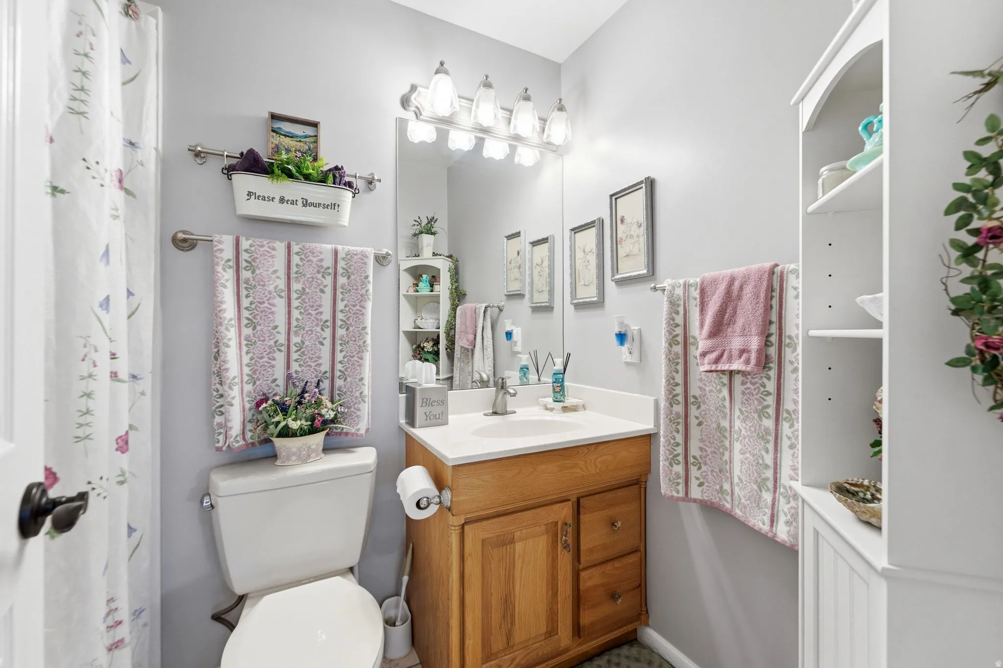 Full bathroom with vanity and a shower with shower curtain