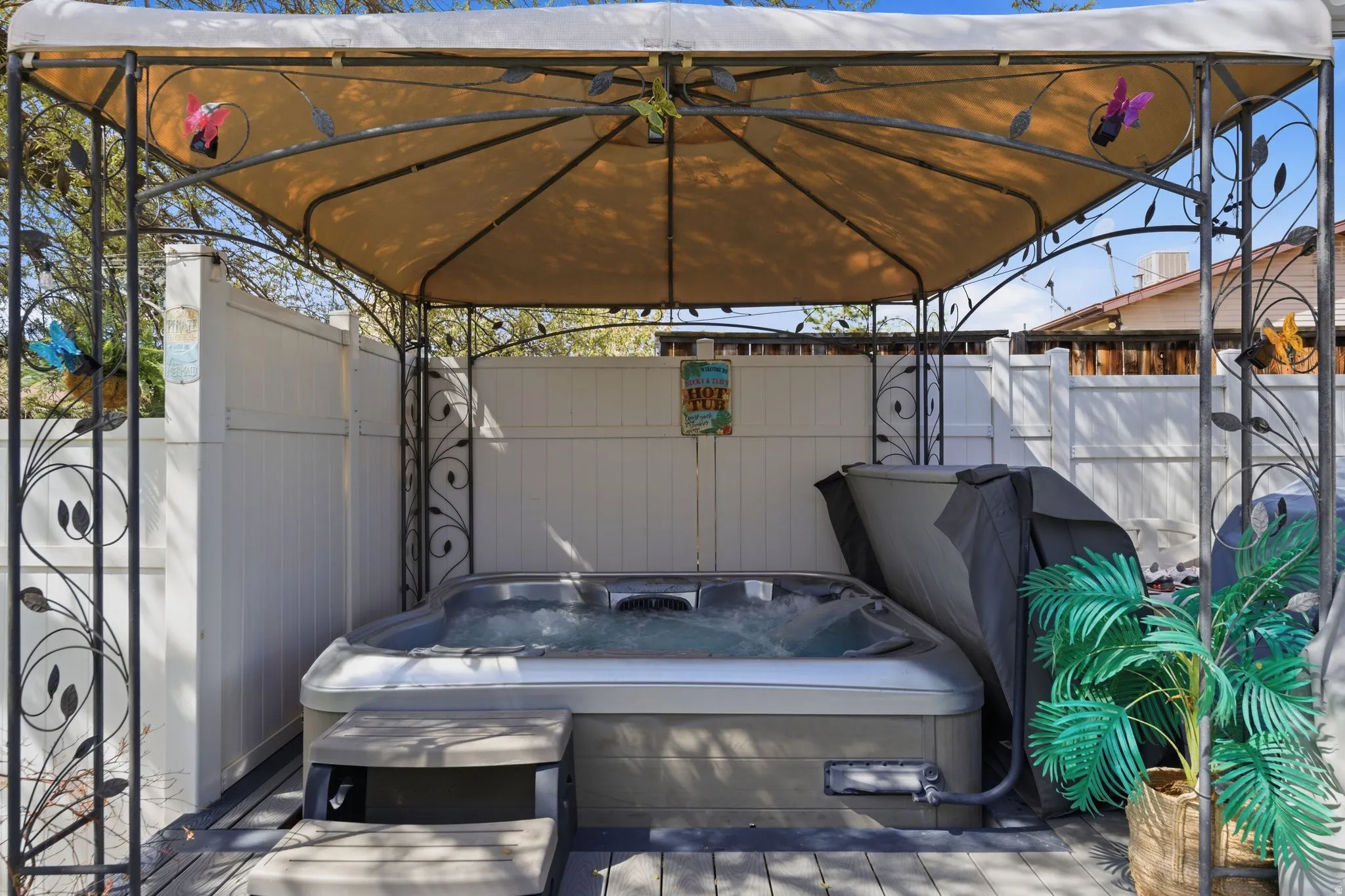 View of patio / terrace with a hot tub