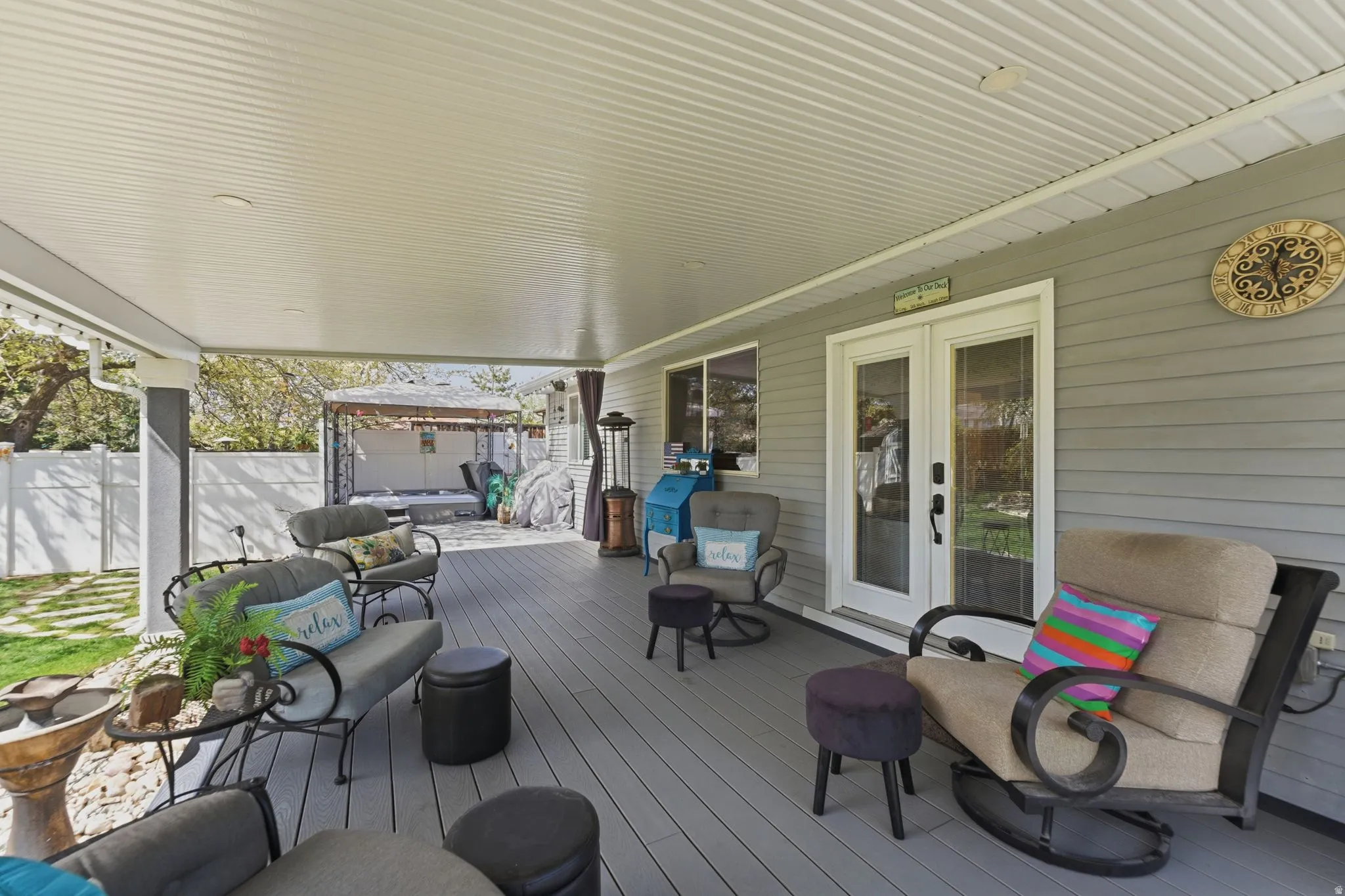 Wooden terrace with french doors and outdoor seating