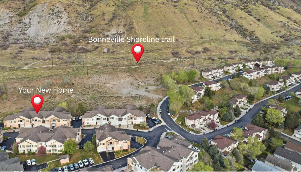 Aerial view of property's location featuring nearby suburban area