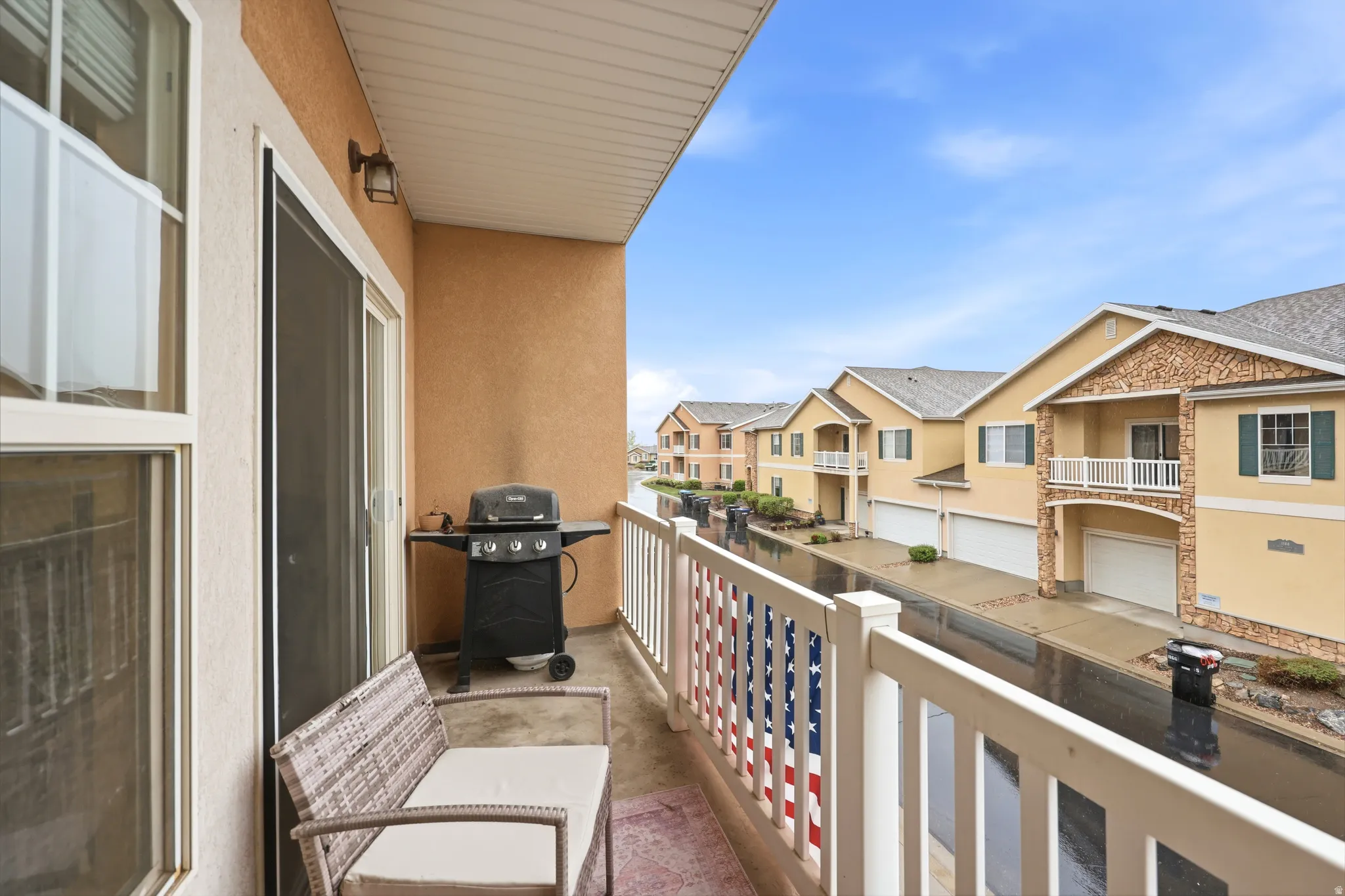 Balcony featuring grilling area and a residential view