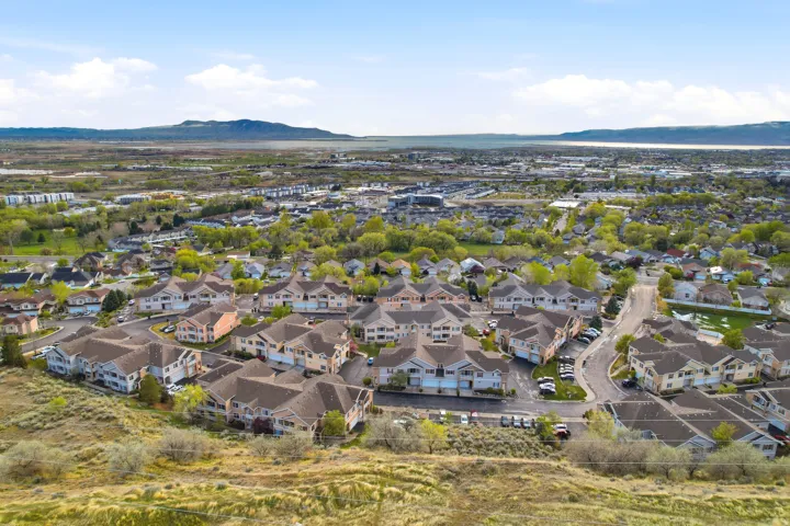 Aerial perspective of suburban area with a mountain backdrop