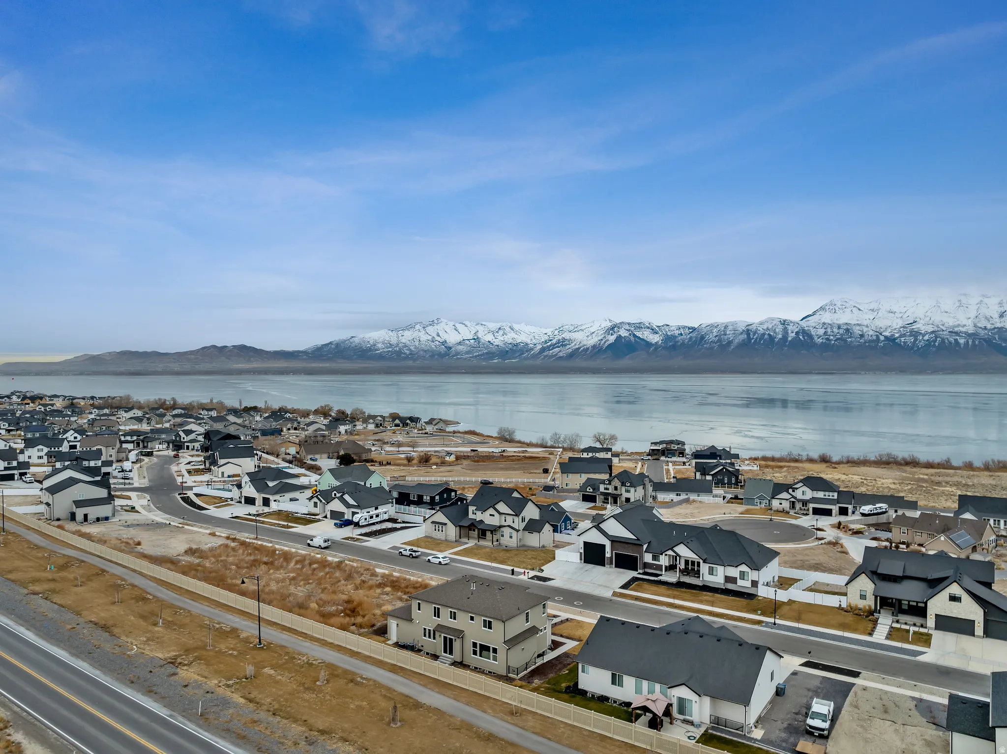 Aerial view of residential area featuring a water and mountain view