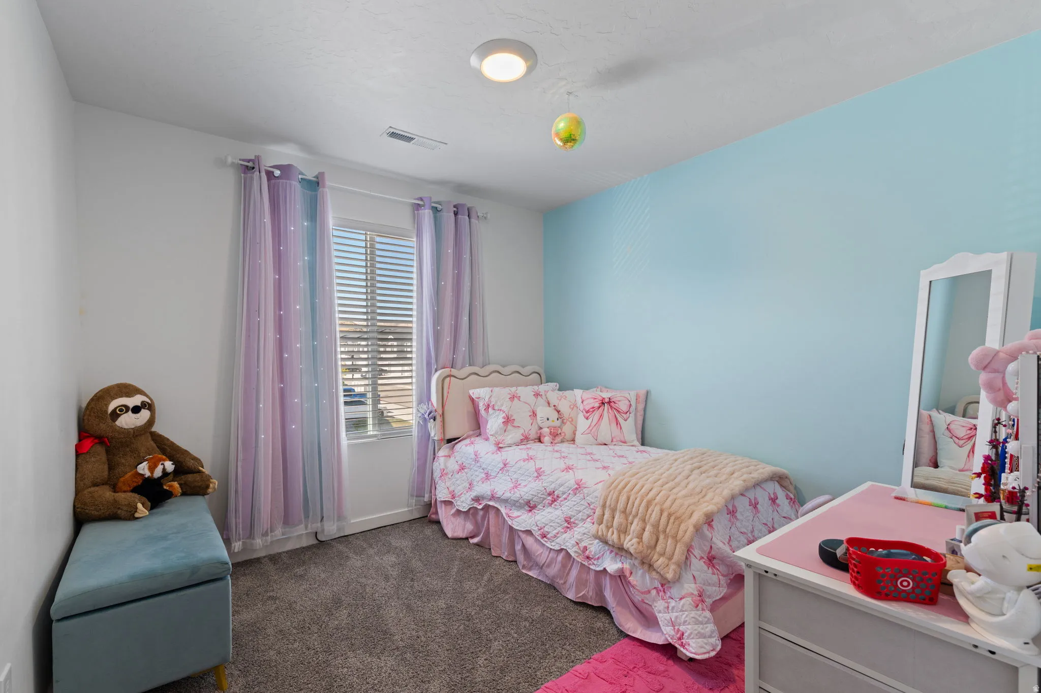 Bedroom with dark colored carpet