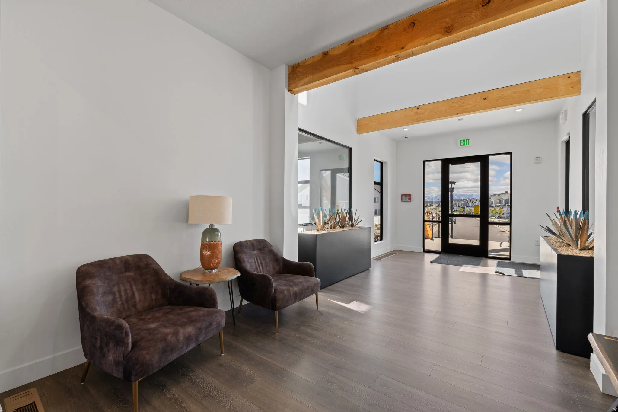 Lobby with beamed ceiling and recessed lighting