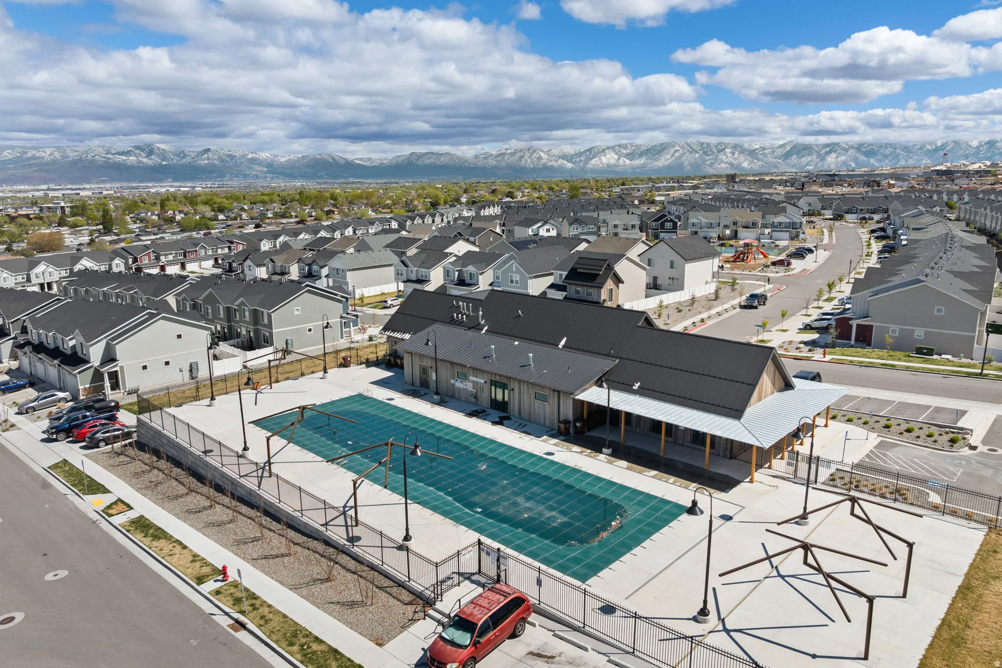 Aerial view of residential area featuring pool