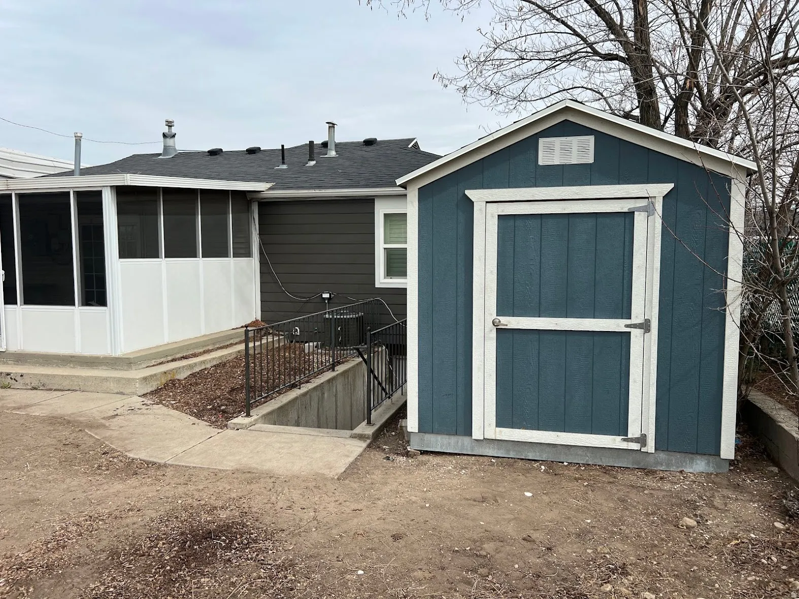 View of shed featuring a sunroom
