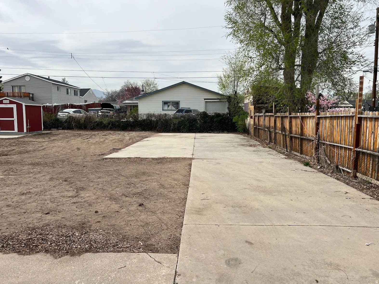 View of yard with a storage unit