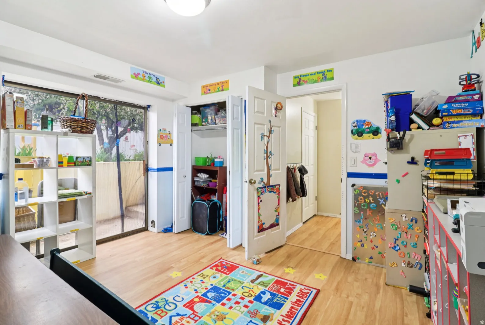 Game room with light wood finished floors