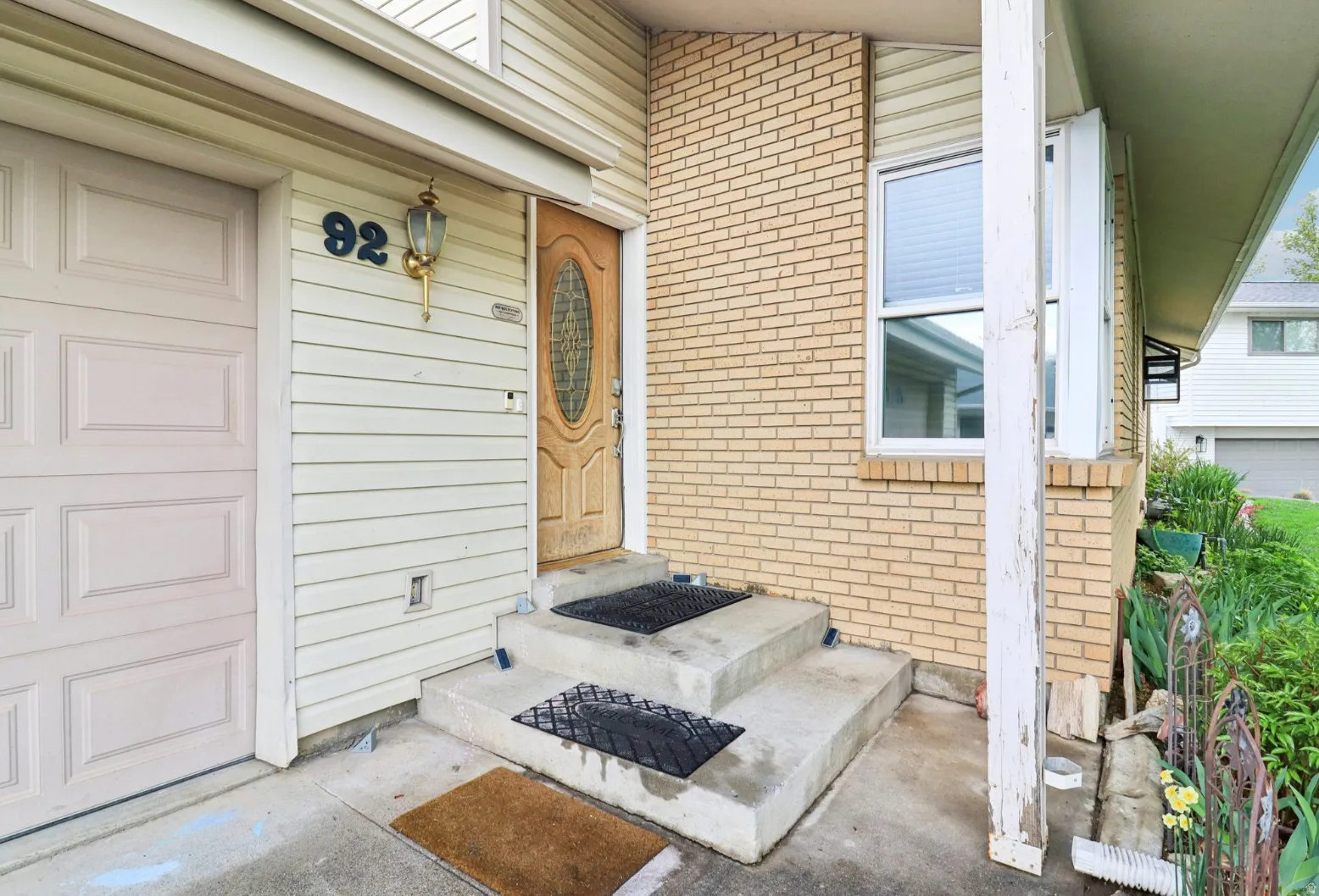 Entrance to property with brick siding