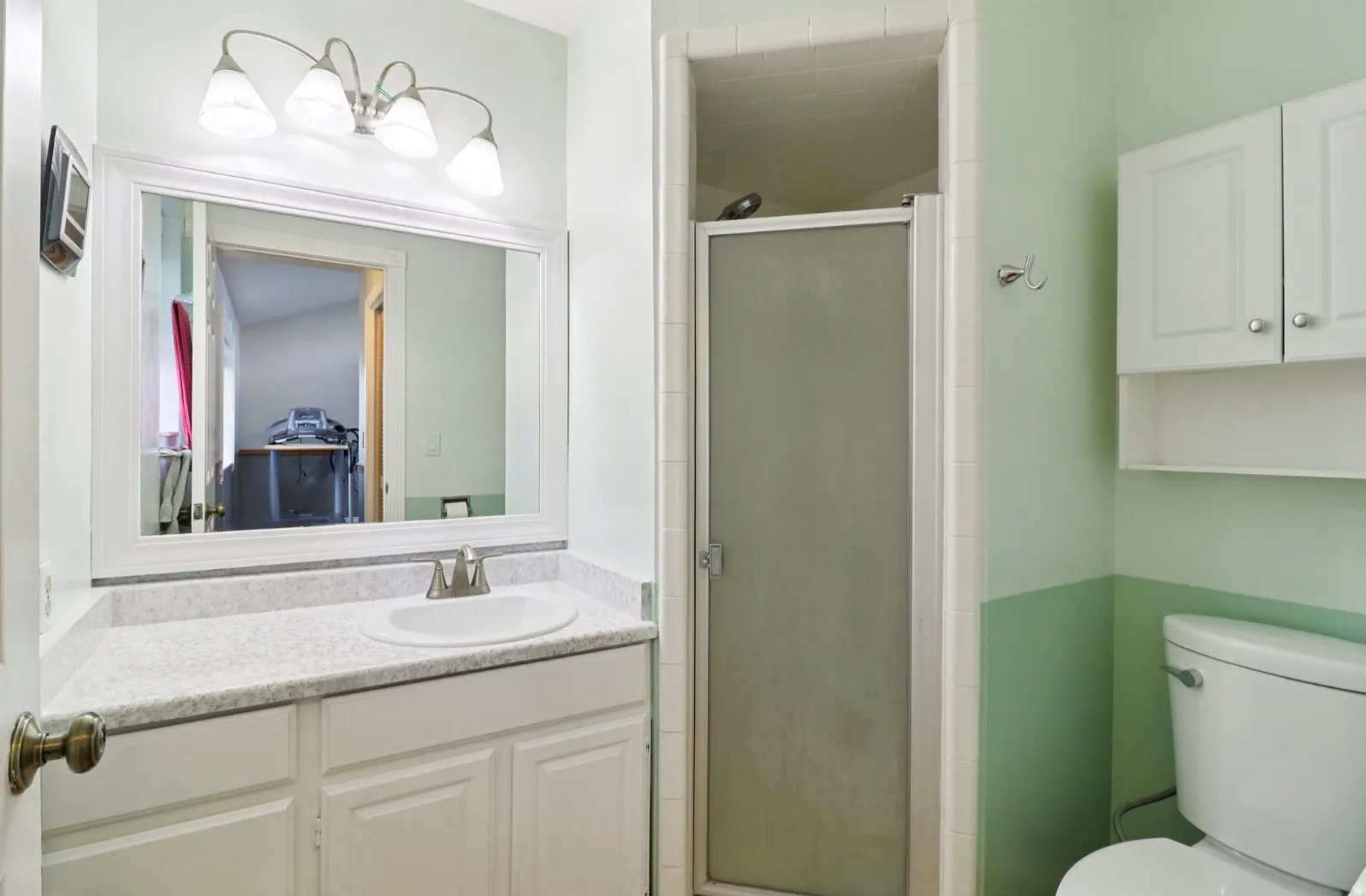 Full bathroom with vanity and a stall shower