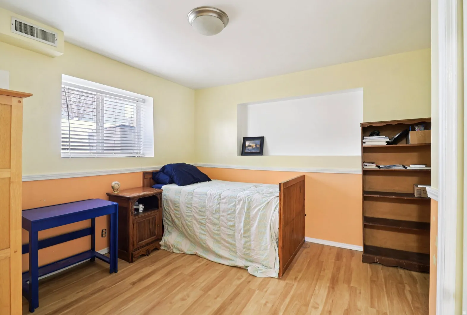 Bedroom featuring light wood-type flooring and baseboards