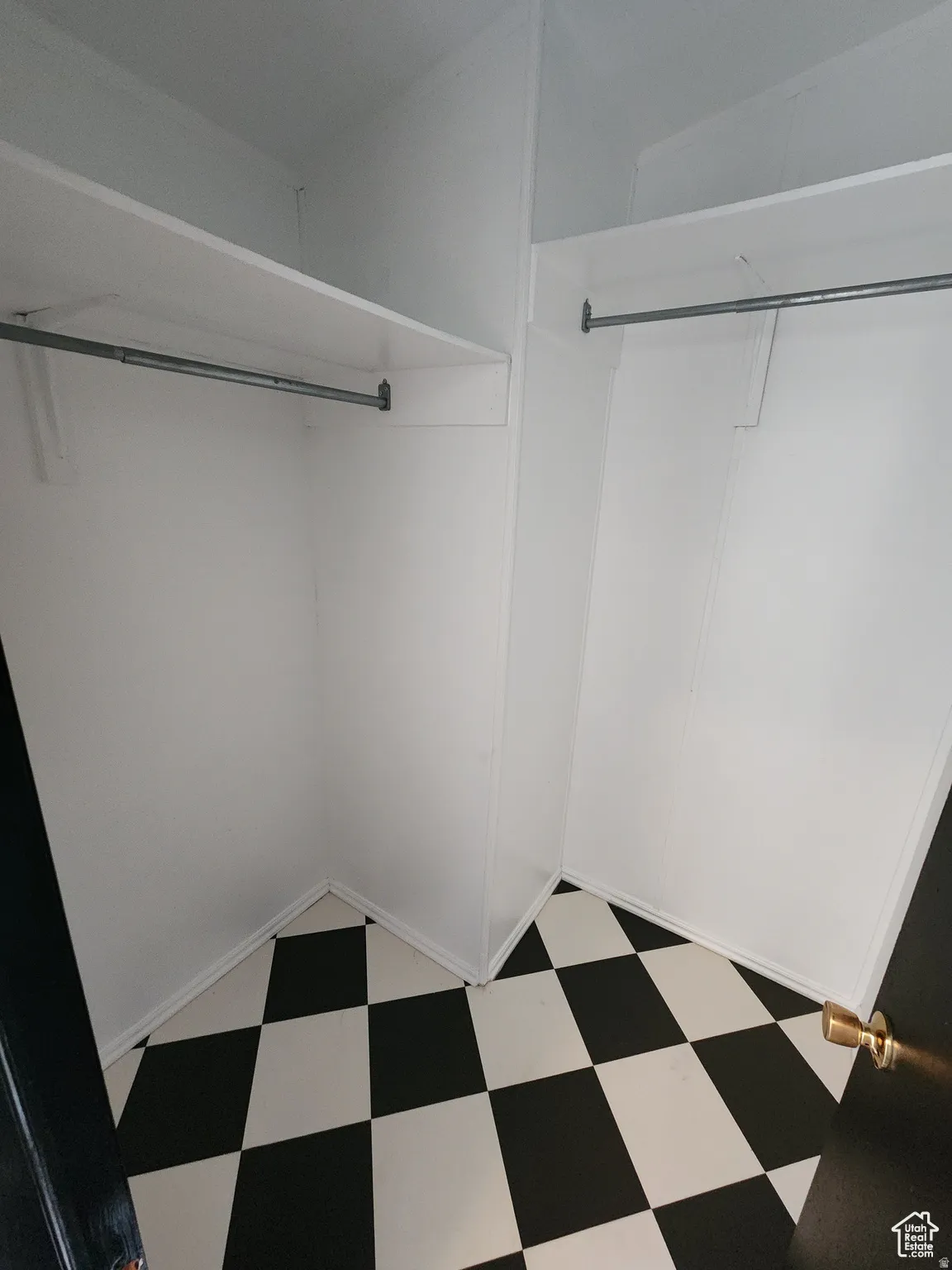 Walk in closet with light floors